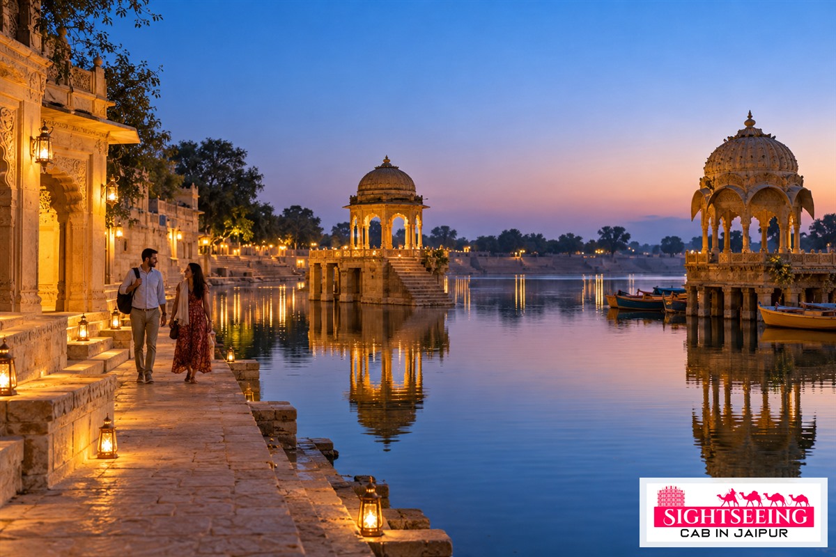 Travellers walking beside Gadisar Lake in Jaisalmer at blue hour